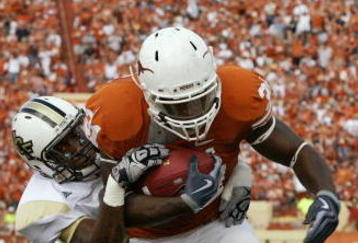 AUSTIN, TX - NOVEMBER 7:  Running back Cody Johnson #31 of the Texas Longhorns scores his second touchdown against the UCF Knights, a third down 13-yard run, on November 7, 2009 at Darrell K Royal - Texas Memorial Stadium in Austin, Texas.  Texas won 35-3.  (Photo by Brian Bahr/Getty Images)