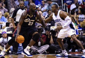 ORLANDO, FL - NOVEMBER 11:  Shaquille O'Neal #33 of the Cleveland Cavaliers looks to maneuver against Dwight Howard #12 of the Orlando Magic during the game on November 11, 2009 at Amway Arena in Orlando, Florida. NOTE TO USER: User expressly acknowledges and agrees that, by downloading and/or using this Photograph, user is consenting to the terms and conditions of the Getty Images License Agreement. (Photo by Sam Greenwood/Getty Images)