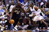 ORLANDO, FL - NOVEMBER 11:  Shaquille O'Neal #33 of the Cleveland Cavaliers looks to maneuver against Dwight Howard #12 of the Orlando Magic during the game on November 11, 2009 at Amway Arena in Orlando, Florida. NOTE TO USER: User expressly acknowledges and agrees that, by downloading and/or using this Photograph, user is consenting to the terms and conditions of the Getty Images License Agreement. (Photo by Sam Greenwood/Getty Images)