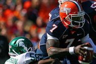CHAMPAIGN, IL - OCTOBER 10: Juice Williams #7 of the Illinois Fighting Illini is sacked by Trevor Anderson #58 of the Michigan State Spartans on October 10, 2009 at Memorial Stadium at the University of Illinois in Champaign, Illinois. Michigan State defeated Illinois 24-14.  (Photo by Jonathan Daniel/Getty Images)