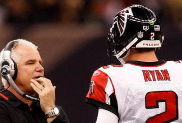 NEW ORLEANS - DECEMBER 07:  Head coach Mike Smith talks with quarterback Matt Ryan #2 of the Atlanta Falcons throws a pass against the New Orleans Saints on December 7, 2008 at the Superdome in New Orleans, Louisiana.   The Saints defeated the Falcons 29-25.  (Photo by Chris Graythen/Getty Images)