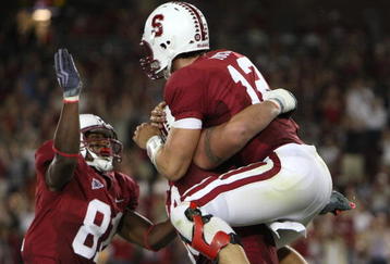PALO ALTO, CA - SEPTEMBER 26:  Andrew Luck #12 of the Stanford Cardinal celebrates after rushing for a touchdown in the fourth quarter against the Washington Huskies at Stanford Stadium on September 26, 2009 in Palo Alto, California.  (Photo by Jed Jacobsohn/Getty Images)
