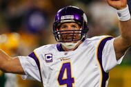 GREEN BAY, WI - NOVEMBER 01: Quarterback Brett Favre #4 of the Minnesota Vikings celebrates a touchdown by teammate Percy Harvin #12 after a 51 yard touchdown pass during the third quarter of the game against the Green Bay Packers at Lambeau Field on November 1, 2009 in Green Bay, Wisconsin. (Photo by Scott Boehm/Getty Images)