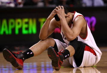 PORTLAND, OR - APRIL 18:  Brandon Roy #7 of the Portland Trail Blazers holds his head after being injured during a scramble for the ball against  the Houston Rockets during Game One of the Western Conference Quarterfinals of the 2009 NBA Playoffs on April 18, 2009 at the Rose Garden in Portland, Oregon. NOTE TO USER: User expressly acknowledges and agrees that, by downloading and or using this Photograph, user is consenting to the terms and conditions of the Getty Images License Agreement.  (Photo by Jonathan Ferrey/Getty Images)