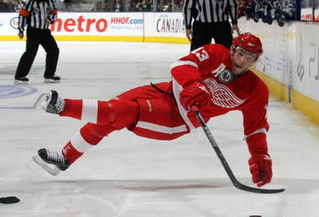 TORONTO, ON - NOVEMBER 07: Pavel Datsyuk #13 of the Detroit Red Wings is tripped up in his game against the Toronto Maple Leafs at the Air Canada Centre on November 7, 2009 in Toronto, Canada. The Maple Leafs defeated the Red Wings 5-1. (Photo by Bruce Bennett/Getty Images)