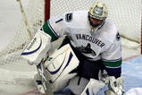 CHICAGO - OCTOBER 21: Roberto Luongo #1 of the Vancouver Canucks keeps his eye on the puck against the Chicago Blackhawks at the United Center on October 14, 2009 in Chicago, Illinois. The Canucks defeated the Blackhawks 3-2. (Photo by Jonathan Daniel/Getty Images)