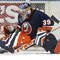 UNIONDALE, NY- MARCH 10: Rick Di Pietro #39 of the New York Islanders makes a pad save against the Toronto Maple Leafs during their game at the Nassau Coliseum on March 10, 2006 in Uniondale, New York. (Photo by Andy Marlin/Getty Images)