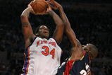 NEW YORK - MARCH 05:  Eddy Curry #34 of the New York Knicks shoots against Joe Smith #32 of the Cleveland Cavaliers during their game on March 5, 2008 at Madison Square Garden in New York City.   NOTE TO USER: User expressly acknowledges and agrees that, by downloading and/or using this Photograph, user is consenting to the terms and conditions of the Getty Images License Agreement.  (Photo by Al Bello/Getty Images)