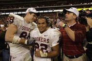 HOUSTON - DECEMBER 7: (Left to Right) Tight end Trent Smith #88, running back Quentin Griffin #22, and head coach Bob Stoops of the University of Oklahoma Sooners celebrate after winning the Big 12 Conference Championship against the University of Colorado Buffaloes at Reliant Stadium on December 7, 2002 in Houston, Texas. The Sooners won 29-7. (Photo by Brian Bahr/Getty Images)