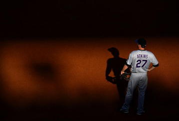 PHILADELPHIA - OCTOBER 08:  Garrett Atkins #27 of the Colorado Rockies stands in the field against the Philadelphia Phillies in Game Two of the NLDS during the 2009 MLB Playoffs at Citizens Bank Park on October 8, 2009 in Philadelphia, Pennsylvania. The Rockies won 5-4. (Photo by Chris McGrath/Getty Images)