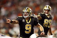 MIAMI - OCTOBER 25: Quarterback Drew Brees #9 of the New Orleans Saints directs his offense pre-snap against the Miami Dolphins at Land Shark Stadium on October 25, 2009 in Miami, Florida. The Saints defeated the Dolphins 46-34. (Photo by Doug Benc/Getty Images)