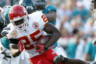 JACKSONVILLE, FL - NOVEMBER 08:  Running back Jamaal Charles #25 of the Kansas City Chiefs gets wrapped up while taking on the Jacksonville Jaguars at Jacksonville Municipal Stadium on November 8, 2009 in Jacksonville, Florida. The Jaguars defeated the Chiefs 24-21.  (Photo by Doug Benc/Getty Images)