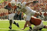 AUSTIN, TX - NOVEMBER 07:  Running back Cody Johnson #31 of the Texas Longhorns runs with the ball against linebacker Cory Hogue #59 of the UCF Knights on November 7, 2009 at Darrell K Royal - Texas Memorial Stadium in Austin, Texas.  Texas won 35-3.  (Photo by Brian Bahr/Getty Images)