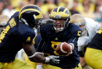 ANN ARBOR, MI - SEPTEMBER 12:  Quarterback Tate Forcier #5 hands off the ball to Brandon Minor #4 against Notre Dame at Michigan Stadium on September 12, 2009 in Ann Arbor, Michigan.  (Photo by Domenic Centofanti/Getty Images)