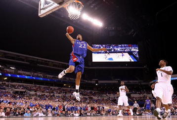 INDIANAPOLIS - MARCH 27:  Marcus Morris #22 of the Kansas Jayhawks drives for a dunk attempt against the Michigan State Spartans during the third round of the NCAA Division I Men's Basketball Tournament at the Lucas Oil Stadium on March 27, 2009 in Indianapolis, Indiana.  (Photo by Andy Lyons/Getty Images)