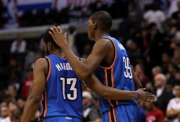 LOS ANGELES, CA - NOVEMBER 11:  Kevin Durant #35 of  the Oklahoma City Thunder celebrates with James Harden #13 in the final seconds of the game against the Los Angeles Clippers on November 11, 2009 at Staples Center in Los Angeles, California.   The Thunder won 83-79.   NOTE TO USER: User expressly acknowledges and agrees that, by downloading and/or using this Photograph, user is consenting to the terms and conditions of the Getty Images License Agreement.  (Photo by Stephen Dunn/Getty Images)