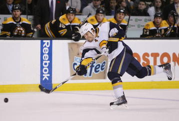 BOSTON - NOVEMBER 07:  Steve Montador #4 of the Buffalo Sabres takes a shot against the Boston Bruins on November 7, 2009 at the TD Garden in Boston, Massachusetts. The Bruins defeated the Sabres 4-2.  (Photo by Elsa/Getty Images)