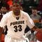 INDIANAPOLIS - MARCH 13:  E'Twaun Moore #33 of the Purdue Boilermakers brings the ball up court against the Penn State Nittany Lions during the second round of the Big Ten Men's Basketball Tournament at Conseco Fieldhouse on March 13, 2009 in Indianapolis, Indiana.  (Photo by Jonathan Daniel/Getty Images)