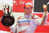SINGAPORE - SEPTEMBER 27:  Timo Glock of Germany and Toyota celebrates on the podium after finishing second during the Singapore Formula One Grand Prix at the Marina Bay Street Circuit on September 27, 2009 in Singapore.  (Photo by Mark Thompson/Getty Images)