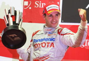 SINGAPORE - SEPTEMBER 27:  Timo Glock of Germany and Toyota celebrates on the podium after finishing second during the Singapore Formula One Grand Prix at the Marina Bay Street Circuit on September 27, 2009 in Singapore.  (Photo by Mark Thompson/Getty Images)