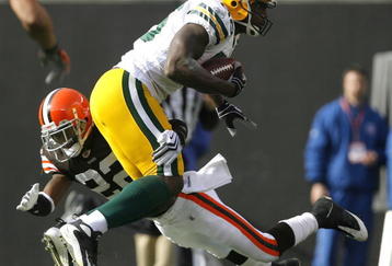 CLEVELAND, OH - OCTOBER 25:  Donald Lee #86 of the Green Bay Packers is hit by Brandon McDonald #22 of the Cleveland Browns at Cleveland Browns Stadium on October 25, 2009 in Cleveland, Ohio.  (Photo by Matt Sullivan/Getty Images)