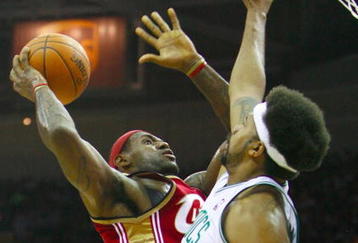 CLEVELAND - OCTOBER 27:  LeBron James #23 of the Cleveland Cavaliers puts up a shot against Rasheed Wallace #30 of the Boston Celtics during the season opener at Quicken Loans Arena on October 27, 2009 in Cleveland, Ohio.  NOTE TO USER: User expressly acknowledges and agrees that, by downloading and or using this photograph, User is consenting to the terms and conditions of the Getty Images License Agreement. (Photo by Gregory Shamus/Getty Images)