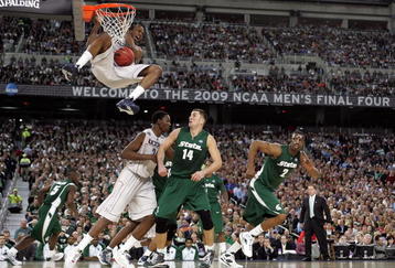 DETROIT - APRIL 04:  Stanley Robinson #21 of the Connecticut Huskies dunks against Goran Suton #14 of the Michigan State Spartans during the National Semifinal game of the NCAA Division I Men's Basketball Championship at Ford Field on April 4, 2009 in Detroit, Michigan. Michigan State won 82-73. (Photo by Andy Lyons/Getty Images)