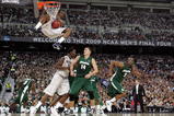 DETROIT - APRIL 04:  Stanley Robinson #21 of the Connecticut Huskies dunks against Goran Suton #14 of the Michigan State Spartans during the National Semifinal game of the NCAA Division I Men's Basketball Championship at Ford Field on April 4, 2009 in Detroit, Michigan. Michigan State won 82-73. (Photo by Andy Lyons/Getty Images)