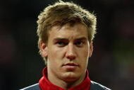 COPENHAGEN, DENMARK - OCTOBER 14: Nicklas Bendtner of Denmark stands for the national anthem during the FIFA 2010 group one World Cup Qualifying match between Denmark and Hungary at the Parken stadium on October 14, 2009 in Copenhagen, Denmark. (Photo by Clive Brunskill/Getty Images)