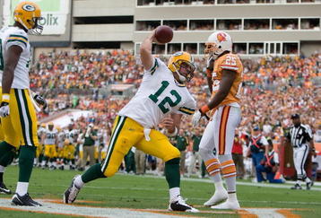 TAMPA, FL - NOVEMBER 08:  Quarterback Aaron Rodgers #12 of the Green Bay Packers spikes the ball after his fourth quarter touchdown against the Tampa Bay Buccaneers during the game at Raymond James Stadium on November 8, 2009 in Tampa, Florida.  (Photo by J. Meric/Getty Images)