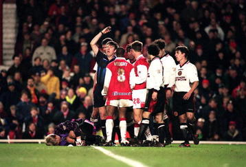19 Feb 1997:  Peter Schmeichel of Manchester United lies injured after clashing with Ian Wright of Arsenal during the FA Carling Pemiership match between Arsenal and Manchester United at Highbury, London. Mandatory Credit: Stu Forster/ALLSPORT