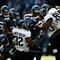 SEATTLE, WA - OCTOBER 11:  The defense of the Seattle Seahawks stops Maurice Jones-Drew #32 of the Jacksonville Jaguars at Qwest Field on October 11, 2009 in Seattle, Washington.  (Photo by Jonathan Ferrey/Getty Images)
