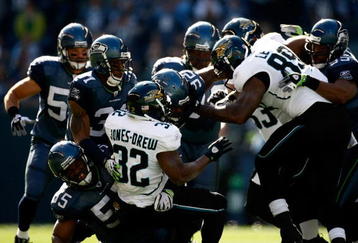 SEATTLE, WA - OCTOBER 11:  The defense of the Seattle Seahawks stops Maurice Jones-Drew #32 of the Jacksonville Jaguars at Qwest Field on October 11, 2009 in Seattle, Washington.  (Photo by Jonathan Ferrey/Getty Images)