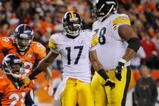 DENVER - NOVEMBER 09: Andre Goodman #21 of the Denver Broncos celebrates with teammate Wesley Woodyard after making an interception as Mike Wallace #17 and Max Starks #78 of the Pittsburgh Steelers look on at Invesco Field at Mile High on November 09, 2009 in Denver, Colorado. (Photo by Doug Pensinger/Getty Images)