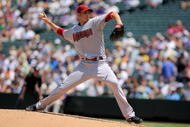 DENVER - JULY 22:  Starting pitcher John Garland #52 of the Arizona Diamondbacks delivers against the Colorado Rockies during MLB action at Coors Field on July 22, 2009 in Denver, Colorado.  (Photo by Doug Pensinger/Getty Images)