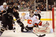 DALLAS - NOVEMBER 04:  DALLAS - NOVEMBER Goaltender Curtis McElhinney #1 of the Calgary Flames makes a save in front of Loui Eriksson #21 of the Dallas Stars at American Airlines Center on November 4, 2009 in Dallas, Texas.  (Photo by Ronald Martinez/Getty Images)