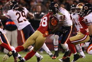 SAN FRANCISCO - NOVEMBER 12:  Devin Hester #23 of the Chicago Bears is hit as he returns a punt by Curtis Taylor #28 0f the San Francisco 49ers at Candlestick Park on November 12, 2009 in San Francisco, California.  (Photo by Jed Jacobsohn/Getty Images)