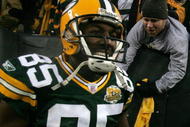 GREEN BAY, WI - JANUARY 12:  Wide receiver Greg Jennings #85 of the Green Bay Packers smiles after catching a two-yard touchdown pass in the second quarter against the Seattle Seahawks during the NFC divisional playoff game on January 12, 2008 at Lambeau Field in Green Bay, Wisconsin. The Packers defeated the Seahawks 42-20 to advance to the NFC championship game. (Photo by Jonathan Daniel/Getty Images)