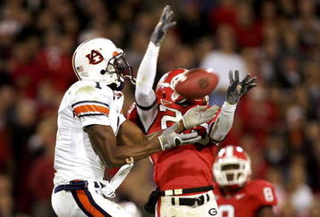 ATHENS, GA - NOVEMBER 12:  Devin Aromashodu #1 of the Auburn Tigers has a pass broken up by Tra Battle #25 of the Georgia Bulldogs during their game on November 12, 2005 at Sanford Stadium in Athens, Georgia.  (Photo By Streeter Lecka)