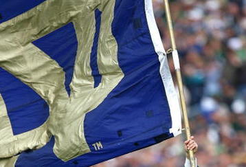 SOUTH BEND, IN - OCTOBER 03: The leprechaun mascot for the Notre Dame Fighting Irish runs onto the field with a flag before a game against the Washington Huskies on October 3, 2009 at Notre Dame Stadium in South Bend, Indiana. Notre Dame defeated Washington 37-30 in overtime. (Photo by Jonathan Daniel/Getty Images)