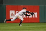 PHILADELPHIA - NOVEMBER 01:  Johnny Damon #18 of the New York Yankees can't make a play on a RBI double hit by Chase Utley #26 of the Philadelphia Phillies in the bottom of the first inning of Game Four of the 2009 MLB World Series at Citizens Bank Park on November 1, 2009 in Philadelphia, Pennsylvania.  (Photo by Al Bello/Getty Images)