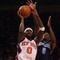 NEW YORK - NOVEMBER 09:  Larry Hughes #0 of the New York Knicks shoots the ball against Ronnie Brewer #9 of the Utah Jazz at Madison Square Garden on November 9, 2009 in New York City. NOTE TO USER: User expressly acknowledges and agrees that, by downloading and or using this photograph, User is consenting to the terms and conditions of the Getty Images License Agreement.  (Photo by Nick Laham/Getty Images)