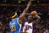 PHOENIX - NOVEMBER 11:  Jason Richardson #23 of the Phoenix Suns looks to pass under pressure from Devin Brown #23 of the New Orleans Hornets during the NBA game at US Airways Center on November 11, 2009 in Phoenix, Arizona. The Suns defeated the Hornets 124-104.  NOTE TO USER: User expressly acknowledges and agrees that, by downloading and or using this photograph, User is consenting to the terms and conditions of the Getty Images License Agreement.  (Photo by Christian Petersen/Getty Images)