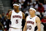 ATLANTA - OCTOBER 28:  Mike Bibby #10 and Josh Smith #5 of the Atlanta Hawks against the Indiana Pacers at Philips Arena on October 28, 2009 in Atlanta, Georgia.  (Photo by Kevin C. Cox/Getty Images)