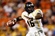 AUBURN, AL - SEPTEMBER 19:  Quarterback Jarrett Brown #16 of the West Virginia Mountaineers against the Auburn Tigers at Jordan-Hare Stadium on September 19, 2009 in Auburn, Alabama.  (Photo by Kevin C. Cox/Getty Images)