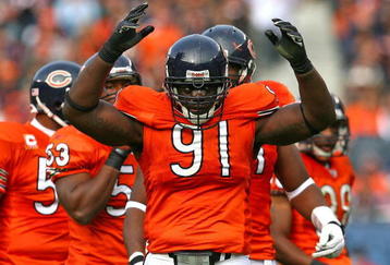 CHICAGO - NOVEMBER 01: Tommie Harris #91 of the Chicago Bears encourages the crowd during a game against the Cleveland Browns at Soldier Field on November 1, 2009 in Chicago, Illinois. The Bears defeated the Browns 30-6. (Photo by Jonathan Daniel/Getty Images)
