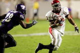FORT WORTH, TX - SEPTEMBER 15:  Running back Quinton Ganther #13 of the Utah Utes runs past Jeremy Modkins #28 of the Texas Christian University Horned Frogs on September 15, 2005 at Amon Carter Stadium in Fort Worth, Texas.  (Photo by Ronald Martinez/Getty Images) 