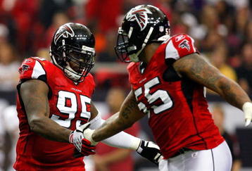 ATLANTA - NOVEMBER 08:  Jonathan Babineaux #95 and John Abraham #55 of the Atlanta Falcons celebrate a sack against the Washington Redskins at Georgia Dome on November 8, 2009 in Atlanta, Georgia.  (Photo by Kevin C. Cox/Getty Images)