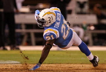 OAKLAND, CA - SEPTEMBER 14:  LaDainian Tomlinson #21 of the San Diego Chargers falls to the turf after he ws tripped up on a running play against the Oakland Raiders on September 14, 2009 at the Oakland-Alameda County Coliseum in Oakland, California.  (Photo by Ezra Shaw/Getty Images)