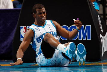 NEW ORLEANS - NOVEMBER 04:  Chris Paul #3 of the New Orleans Hornets sits on the ground after being fouled during the game against  the Dallas Mavericks at New Orleans Arena on November 4, 2009 in New Orleans, Louisiana.  NOTE TO USER: User expressly acknowledges and agrees that, by downloading and or using this photograph, User is consenting to the terms and conditions of the Getty Images License Agreement.  (Photo by Chris Graythen/Getty Images)